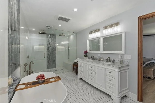 a bedroom with furniture and a wooden floor