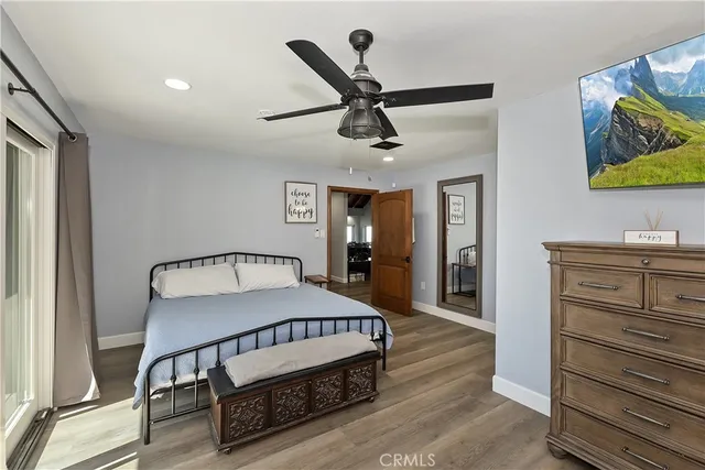 a living room with furniture a table and kitchen view