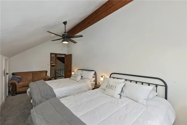 a view of living room and patio with wooden floor