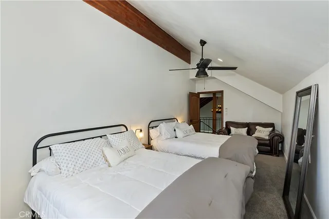 a view of a balcony with furniture and wooden floor