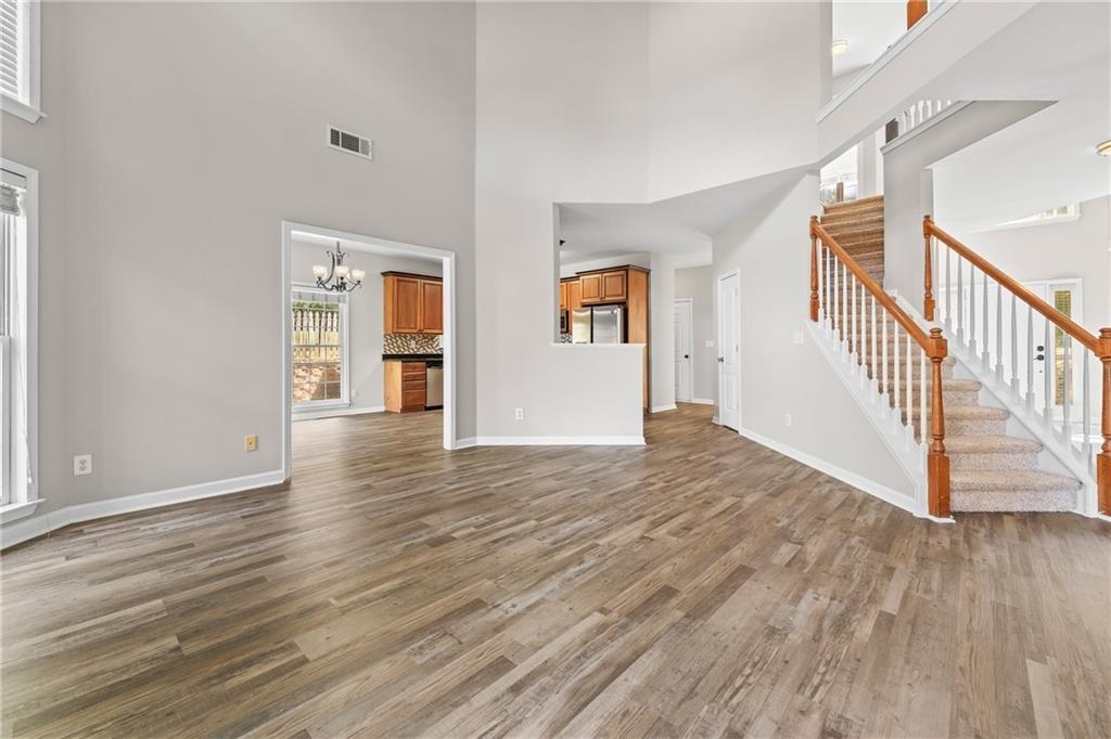 2878 Calhoun Square Suwanee, GA 30024 - Photo 14 of 42 a view of empty room with wooden floor