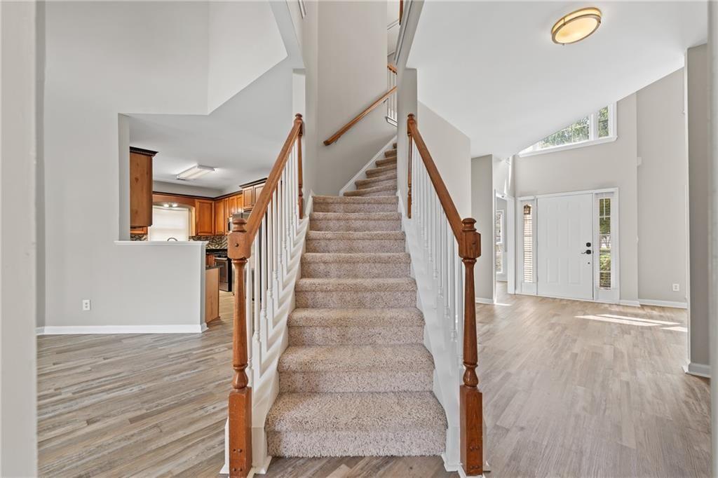 2878 Calhoun Square Suwanee, GA 30024 - Photo 22 of 42 a view of entryway and hall with wooden floor
