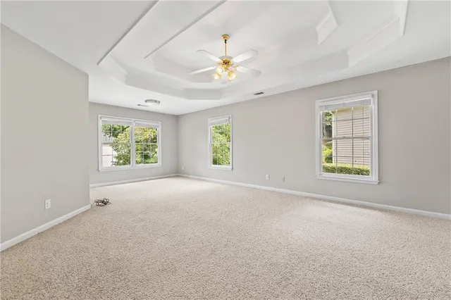 a bathroom with a granite countertop sink mirror and a bathtub
