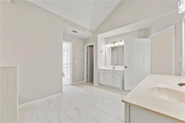 a view of house with backyard