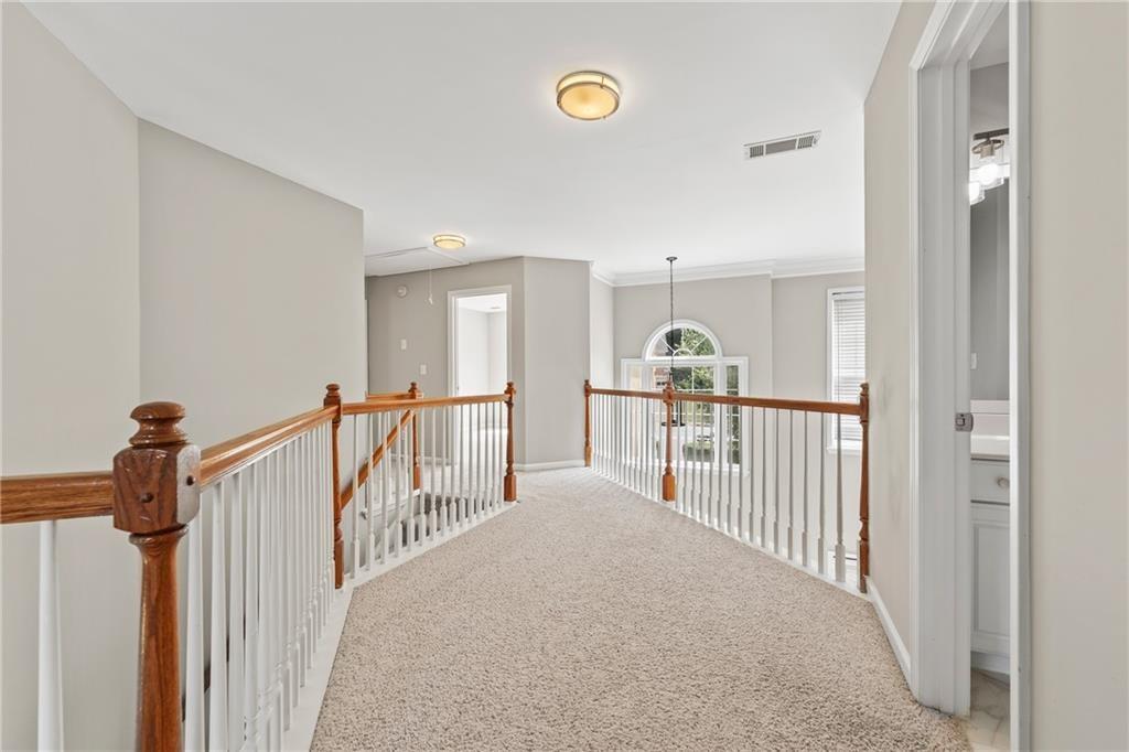 2878 Calhoun Square Suwanee, GA 30024 - Photo 31 of 42 a view of a hallway with a window
