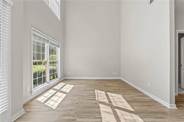 a view of a hallway view with wooden floor and staircase