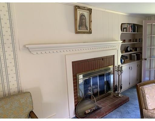 557 Southbridge Road Warren, MA 01585 - Photo 11 of 30 a living room with furniture and a fireplace