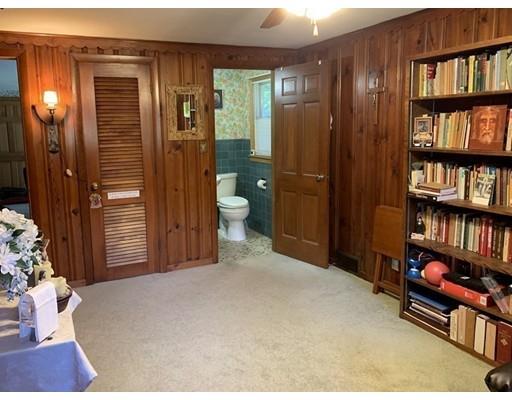 557 Southbridge Road Warren, MA 01585 - Photo 15 of 30 a bedroom with a bed and a book shelf