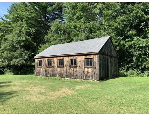 557 Southbridge Road Warren, MA 01585 - Photo 18 of 30 a house that is sitting in the grass with large trees