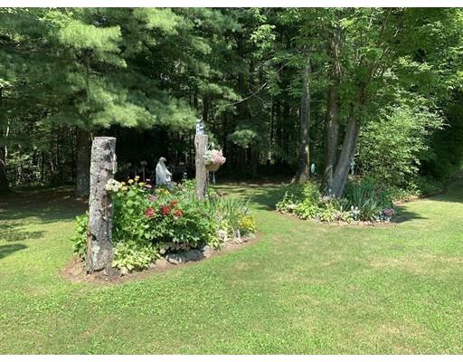 557 Southbridge Road Warren, MA 01585 - Photo 23 of 30 a backyard of a house with lots of green space