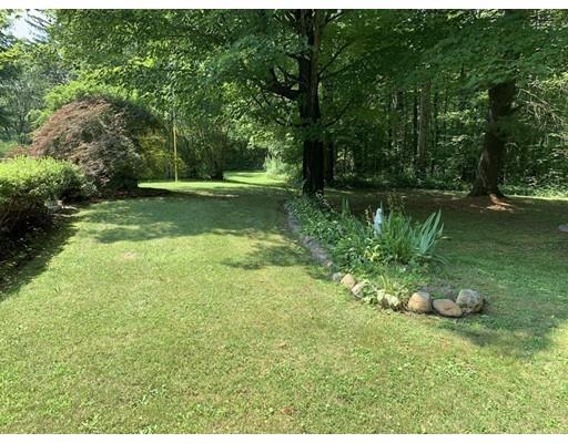 557 Southbridge Road Warren, MA 01585 - Photo 24 of 30 a view of a garden with a lake