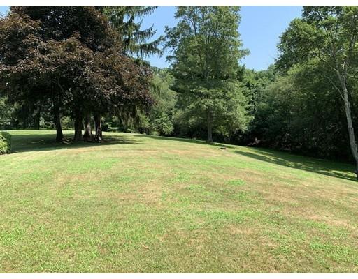 557 Southbridge Road Warren, MA 01585 - Photo 26 of 30 a view of a field with a trees in the background