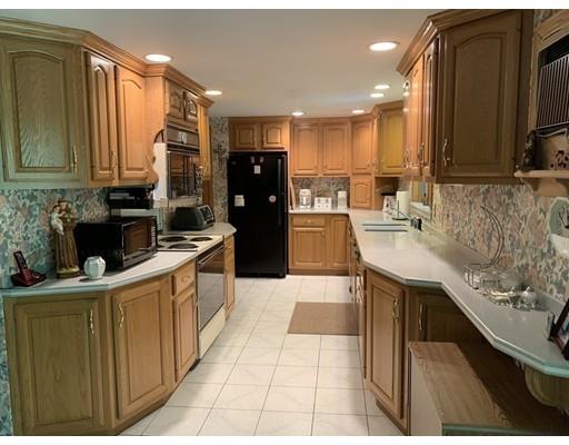 557 Southbridge Road Warren, MA 01585 - Photo 5 of 30 a kitchen with stainless steel appliances kitchen island granite countertop a refrigerator a stove and a sink
