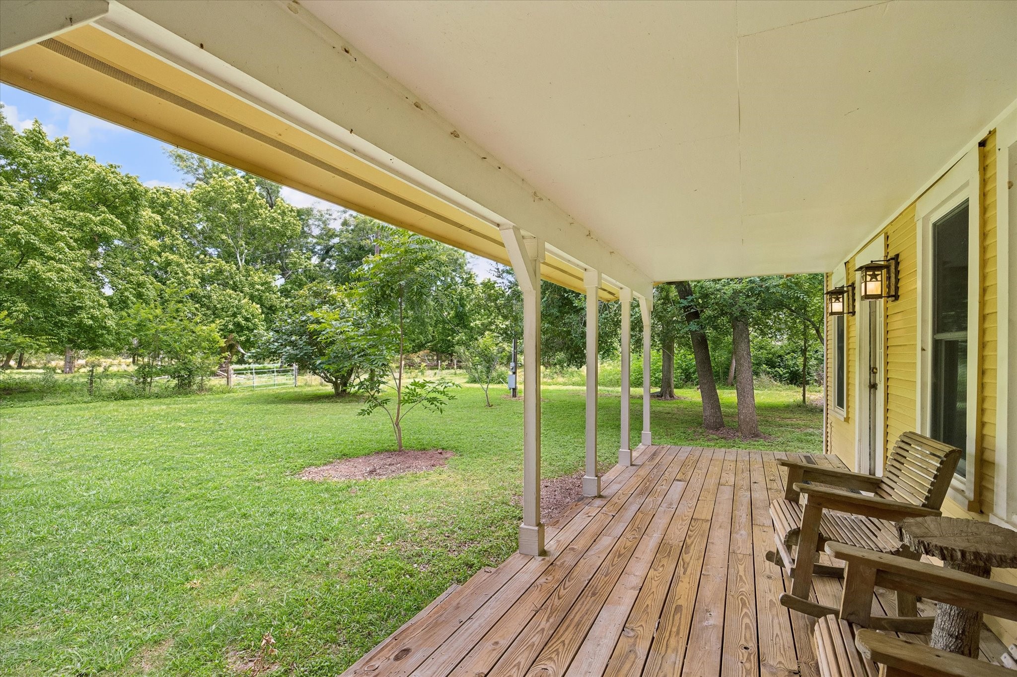 2511 Hartwell Road Pattison, TX 77423 - Photo 8 of 27 Covered porch perfect for enjoying sunsets, morning coffee, and peaceful country living.