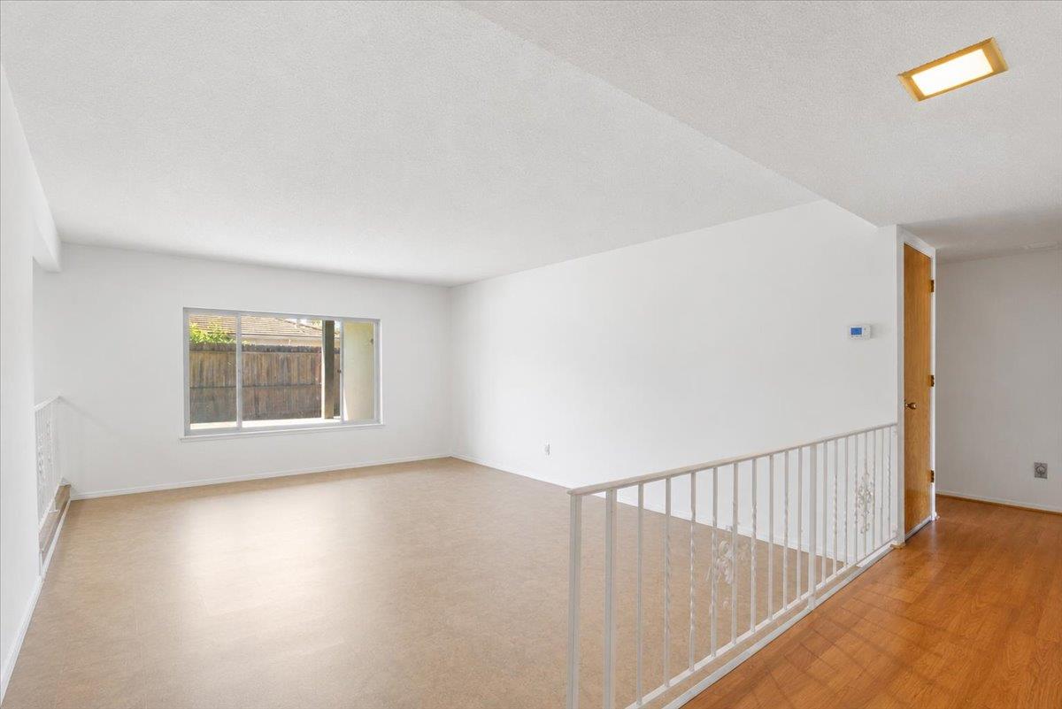 69 Springbrook Circle Sacramento, CA 95831 - Photo 7 of 29 a view of an empty room with wooden floor and a window