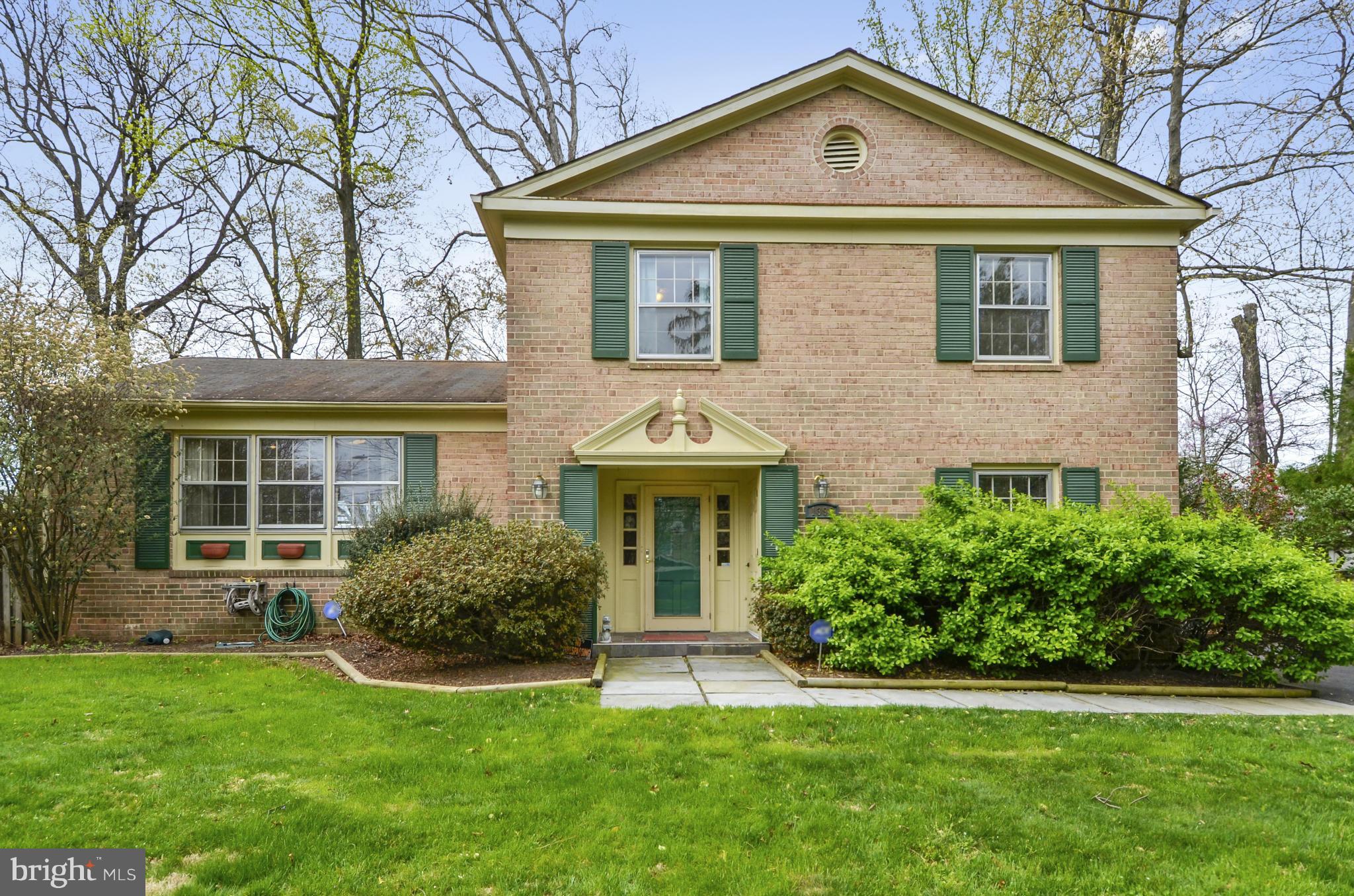 1395 Kimblewick Road Potomac, MD 20854 - Photo 1 of 30 a front view of a house with a yard and trees