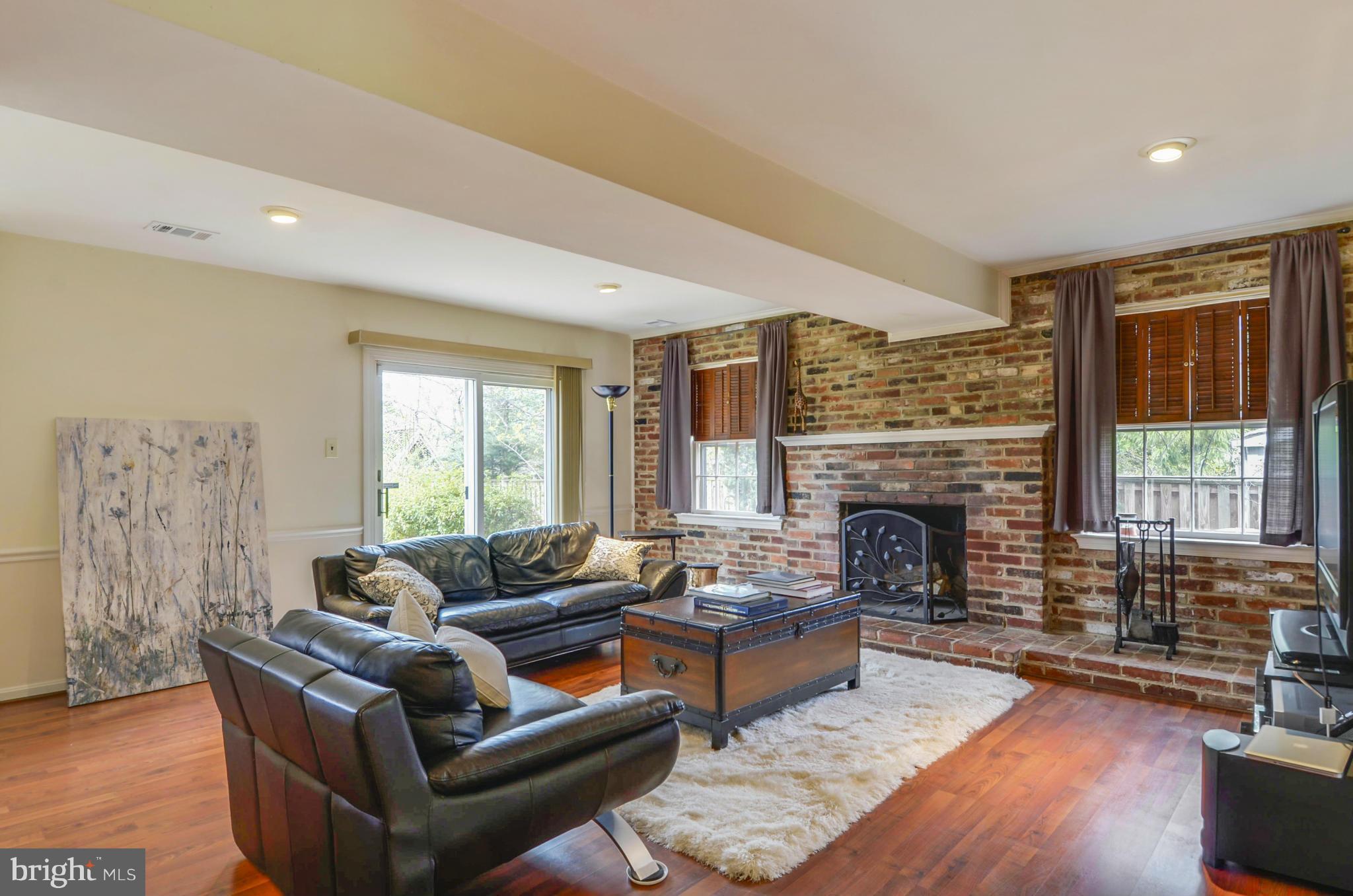 1395 Kimblewick Road Potomac, MD 20854 - Photo 11 of 30 a living room with furniture and a fireplace