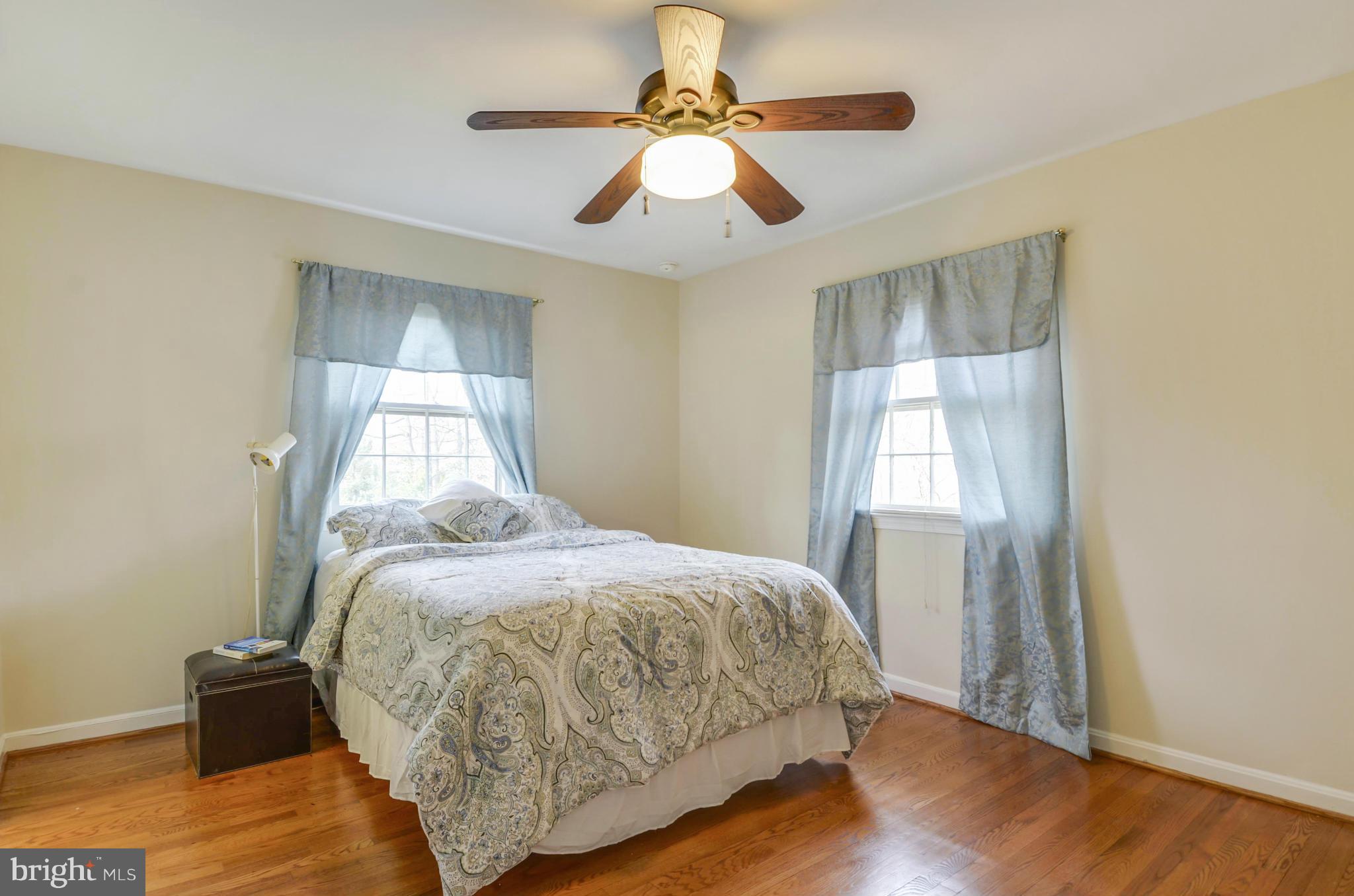1395 Kimblewick Road Potomac, MD 20854 - Photo 16 of 30 a bedroom with a bed and wooden floor