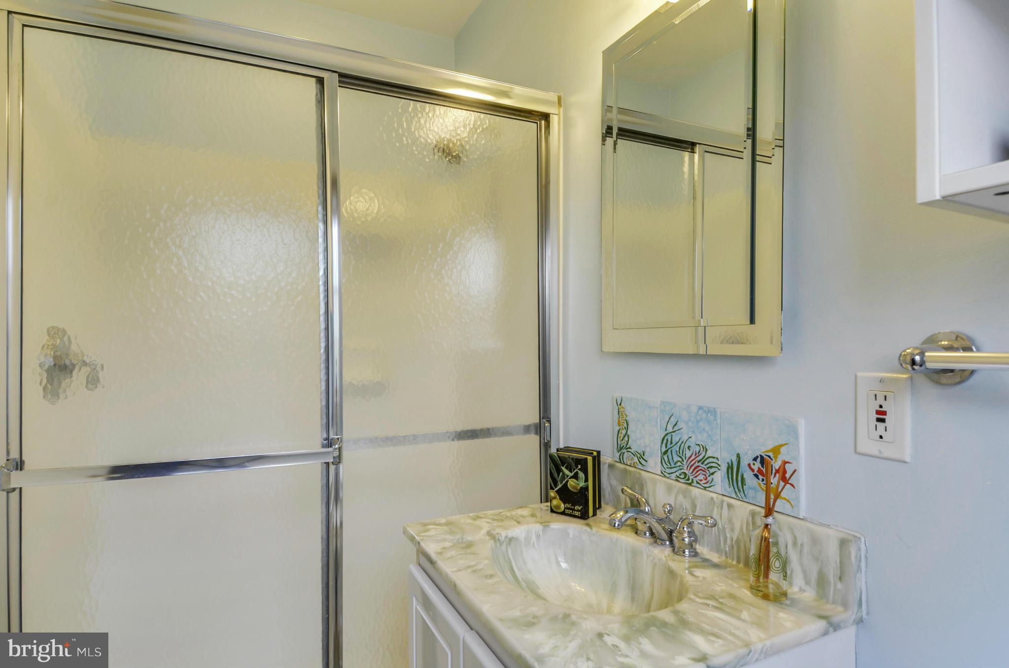 1395 Kimblewick Road Potomac, MD 20854 - Photo 18 of 30 a bathroom with a sink and a mirror