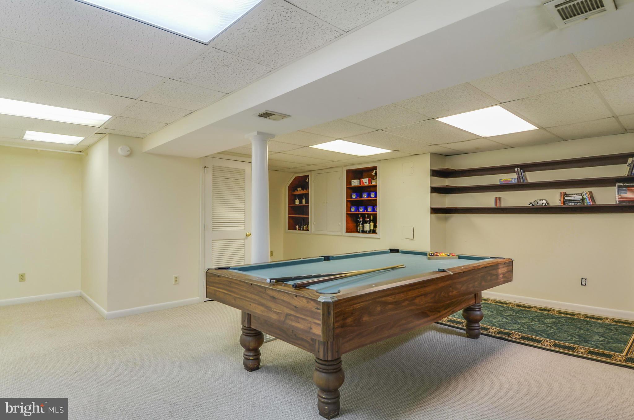 1395 Kimblewick Road Potomac, MD 20854 - Photo 24 of 30 a room with pool table and windows