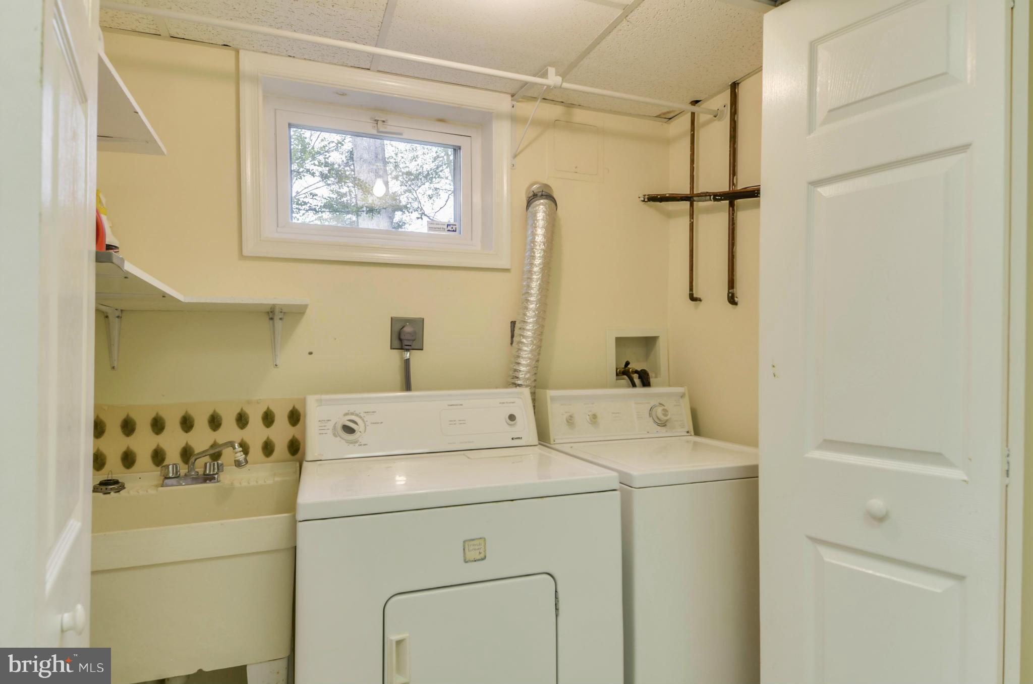 1395 Kimblewick Road Potomac, MD 20854 - Photo 25 of 30 a utility room with dryer and washer