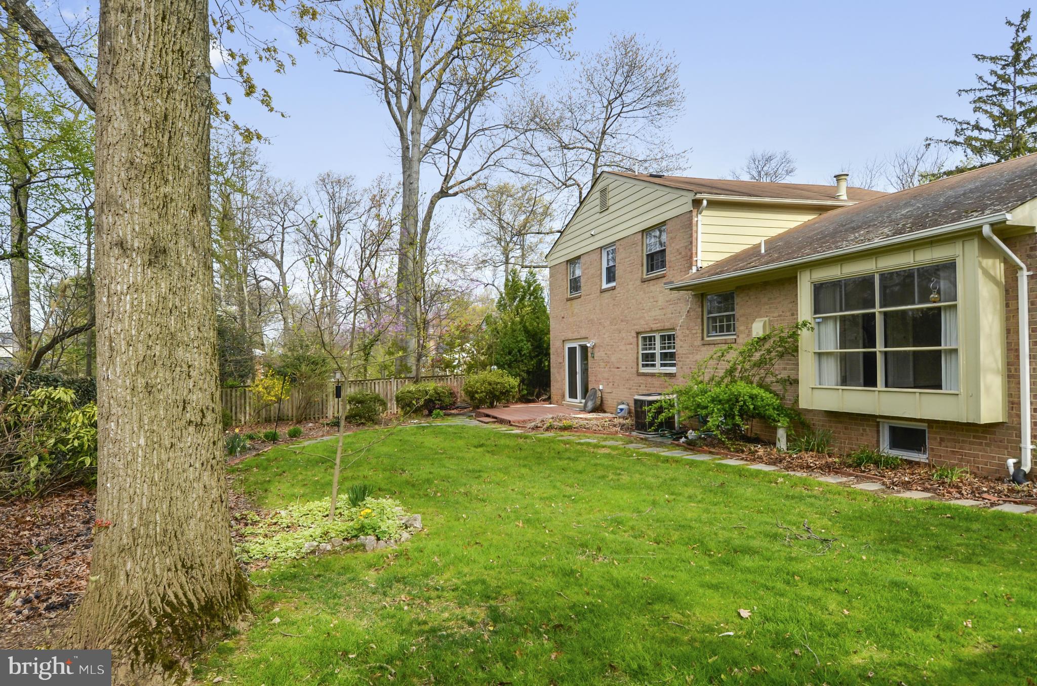 1395 Kimblewick Road Potomac, MD 20854 - Photo 26 of 30 a front view of a house with a yard