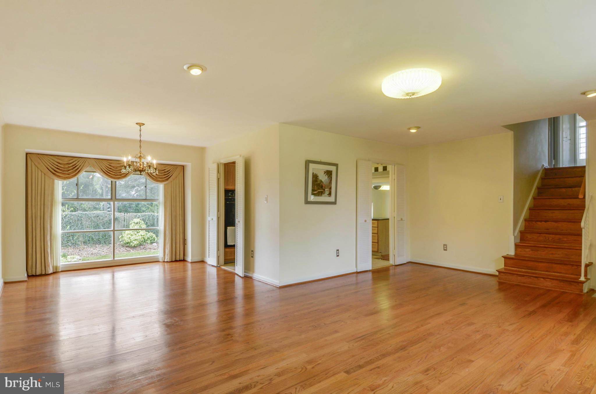 1395 Kimblewick Road Potomac, MD 20854 - Photo 6 of 30 wooden floor in an empty room with a window