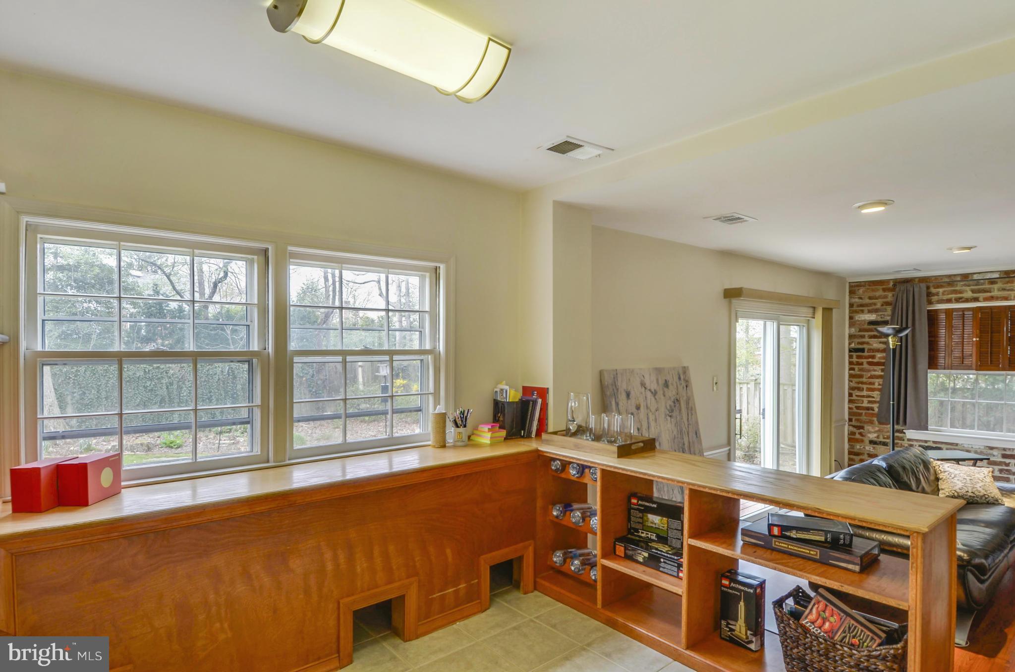 1395 Kimblewick Road Potomac, MD 20854 - Photo 10 of 30 a living room with furniture and large windows