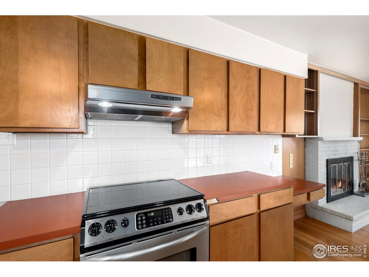 409 7th Street Windsor, CO 80550 - Photo 12 of 42 a kitchen with a stove and a microwave