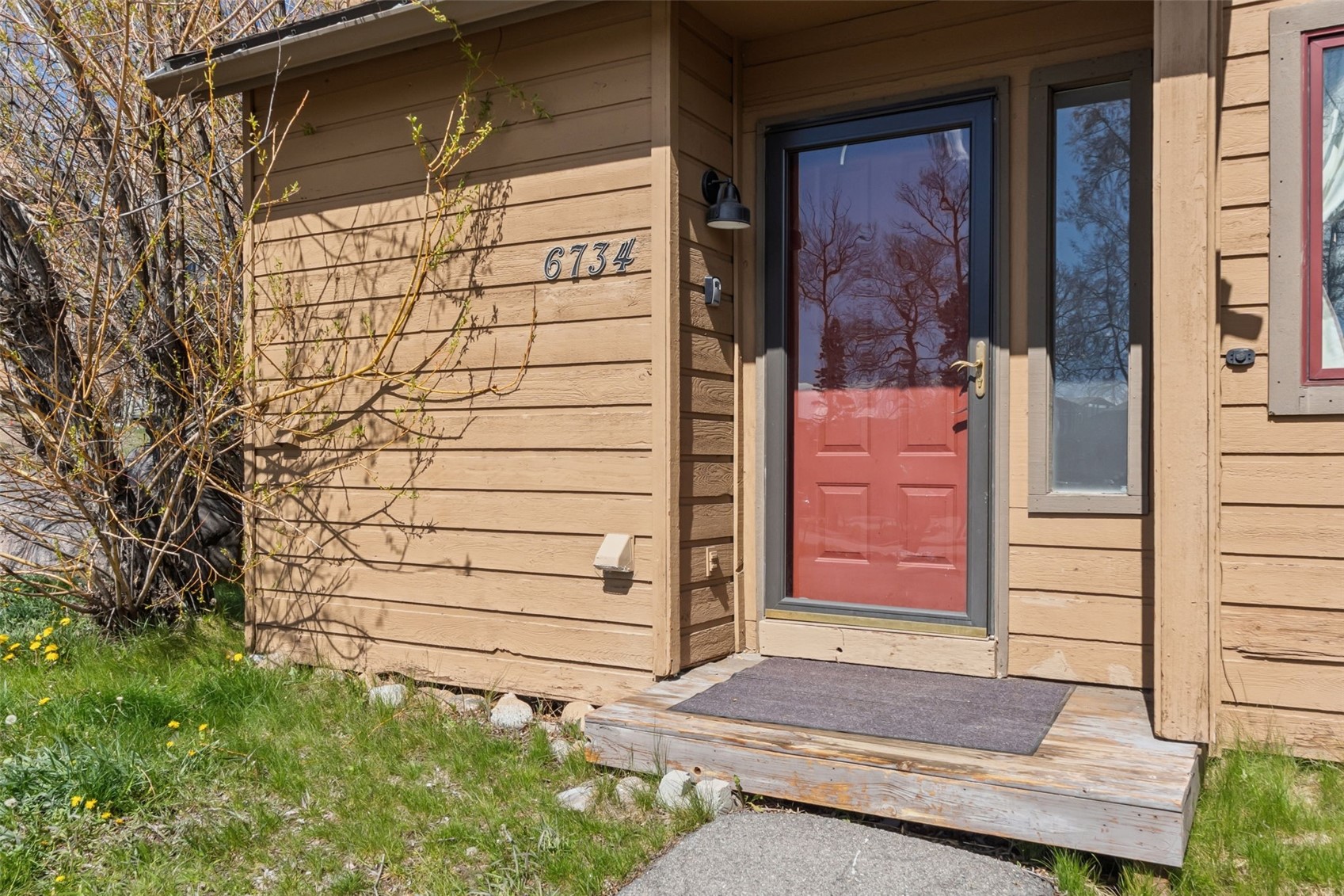 6734 Ryan Gulch Road, Unit 6734 Silverthorne, CO 80498 - Photo 33 of 33 a front view of a house with a yard