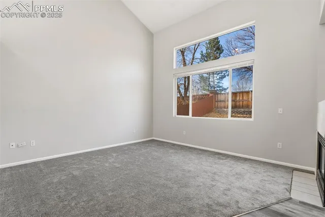 a view of an empty room with closet