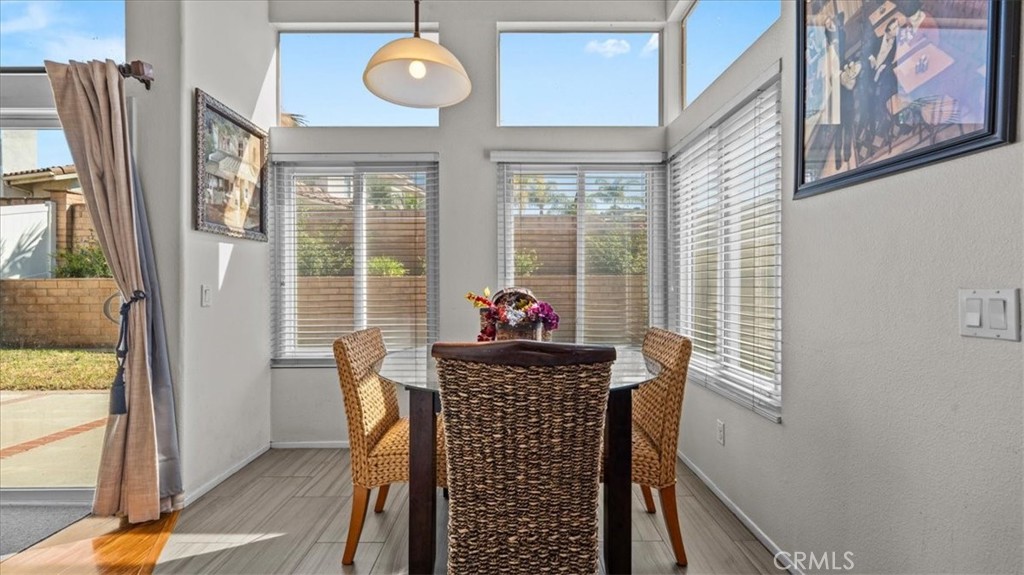 1671 Dominguez Ranch Road Corona, CA 92878 - Photo 11 of 42 a dining room with furniture and window