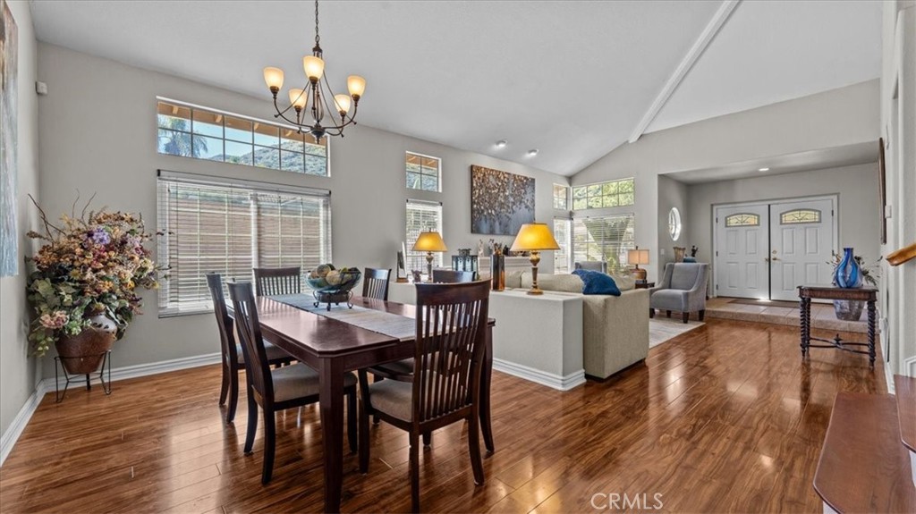 1671 Dominguez Ranch Road Corona, CA 92878 - Photo 12 of 42 a view of a dining room with furniture window and wooden floor