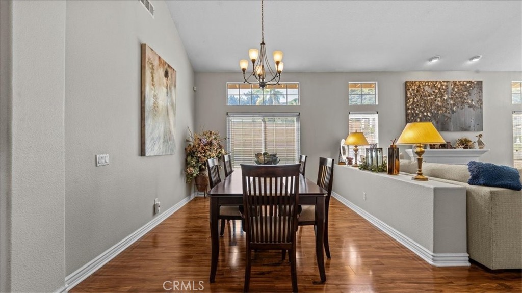 1671 Dominguez Ranch Road Corona, CA 92878 - Photo 13 of 42 a view of a livingroom with furniture wooden floor and windows