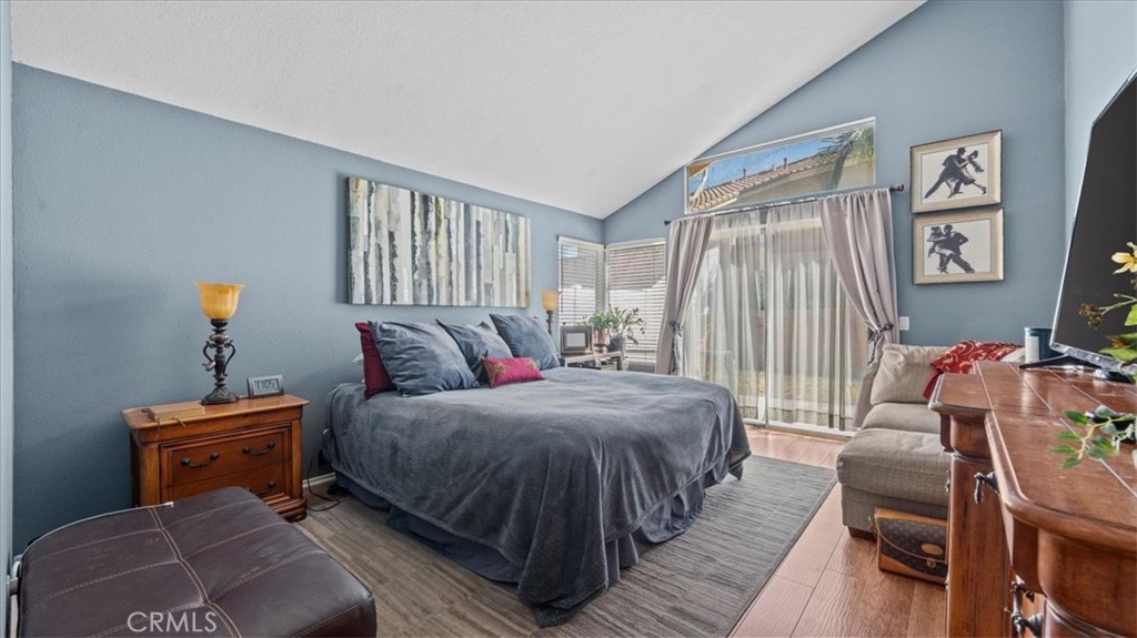 1671 Dominguez Ranch Road Corona, CA 92878 - Photo 19 of 42 a living room with a bed couch and a window