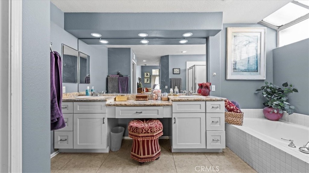 1671 Dominguez Ranch Road Corona, CA 92878 - Photo 21 of 42 a bathroom with a sink double vanity and a mirror
