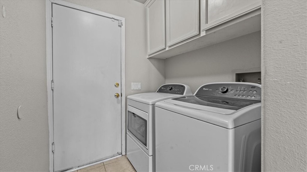 1671 Dominguez Ranch Road Corona, CA 92878 - Photo 27 of 42 a utility room with dryer and washer