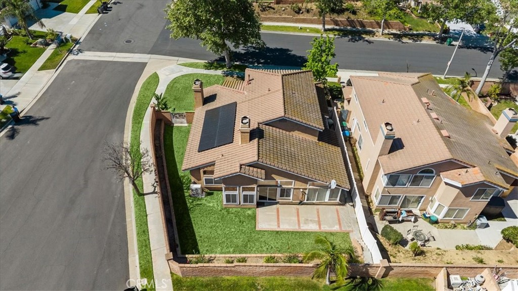 1671 Dominguez Ranch Road Corona, CA 92878 - Photo 34 of 42 an aerial view of a house with a garden and swimming pool
