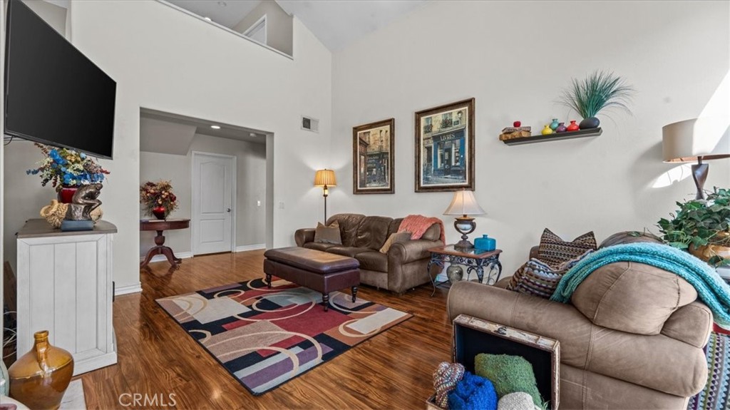 1671 Dominguez Ranch Road Corona, CA 92878 - Photo 6 of 42 a living room with furniture and a flat screen tv