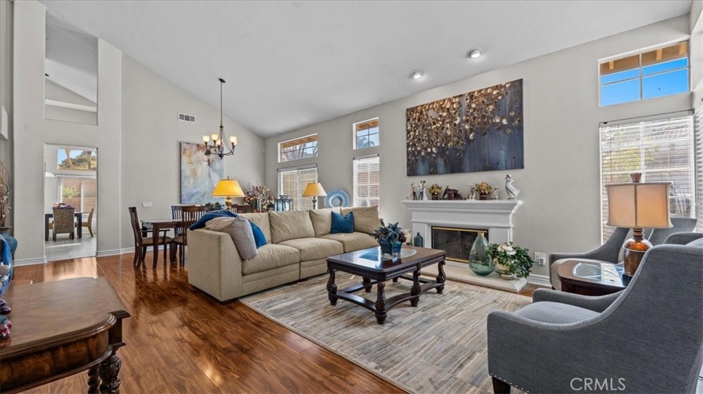 1671 Dominguez Ranch Road Corona, CA 92878 - Photo 7 of 42 a living room with furniture and a fireplace