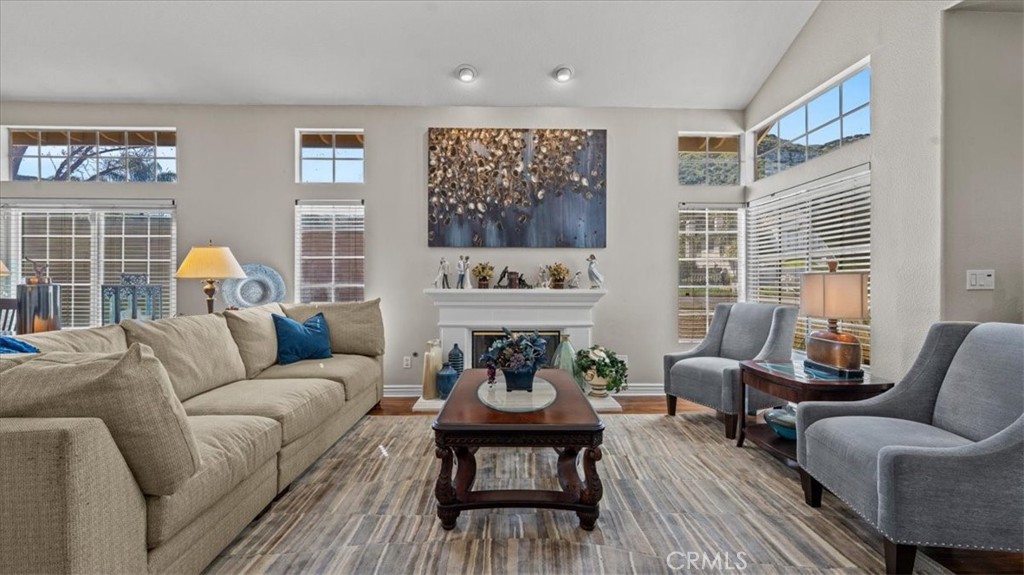 1671 Dominguez Ranch Road Corona, CA 92878 - Photo 8 of 42 a living room with furniture fireplace and window