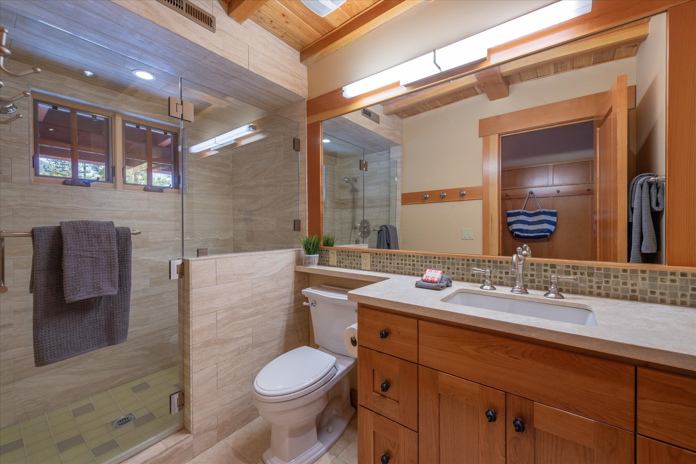 12416 Tom Dolley Truckee, CA 96161 - Photo 11 of 21 a bathroom with a sink a toilet and mirror