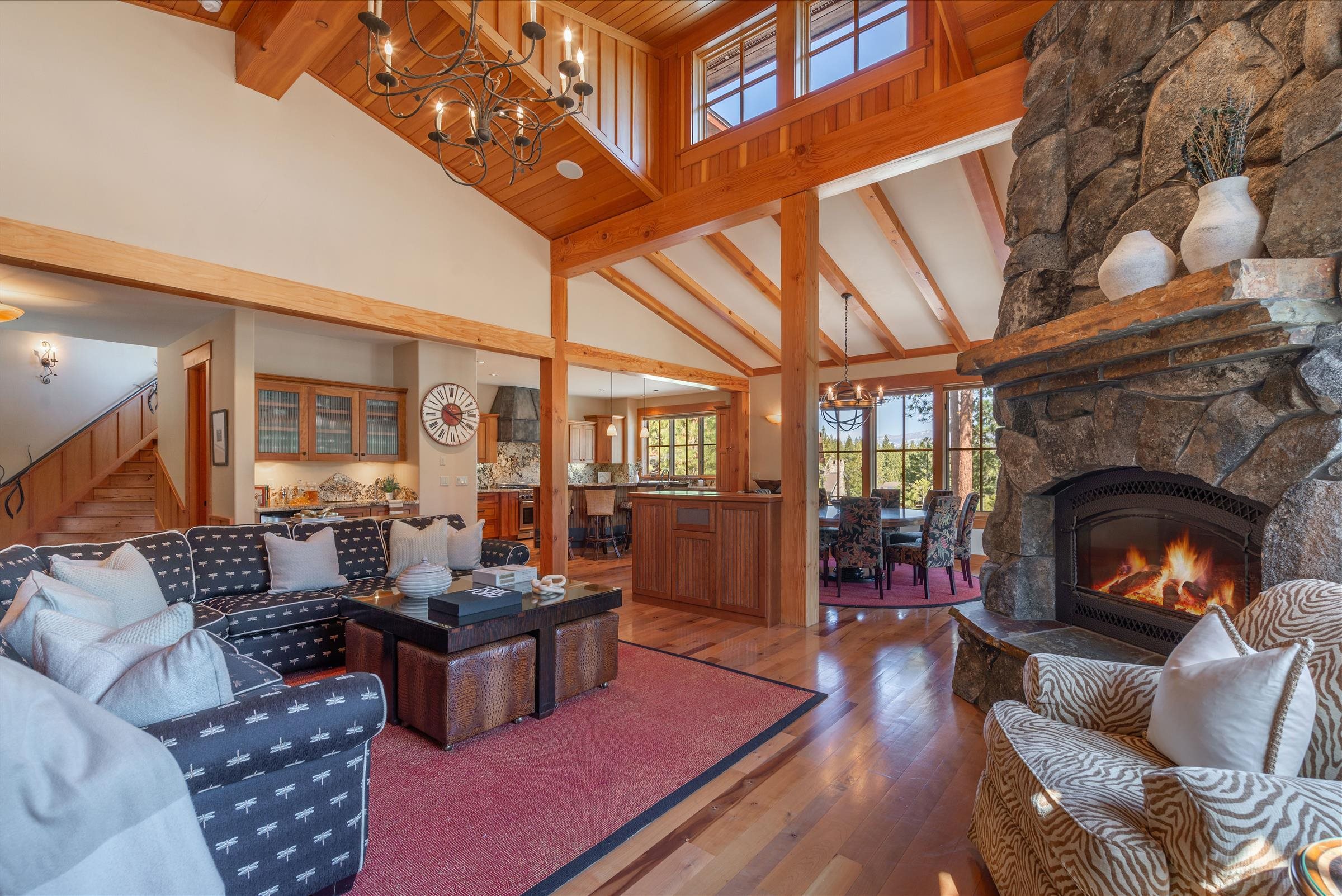 12416 Tom Dolley Truckee, CA 96161 - Photo 4 of 21 a living room with furniture a fireplace and a large window