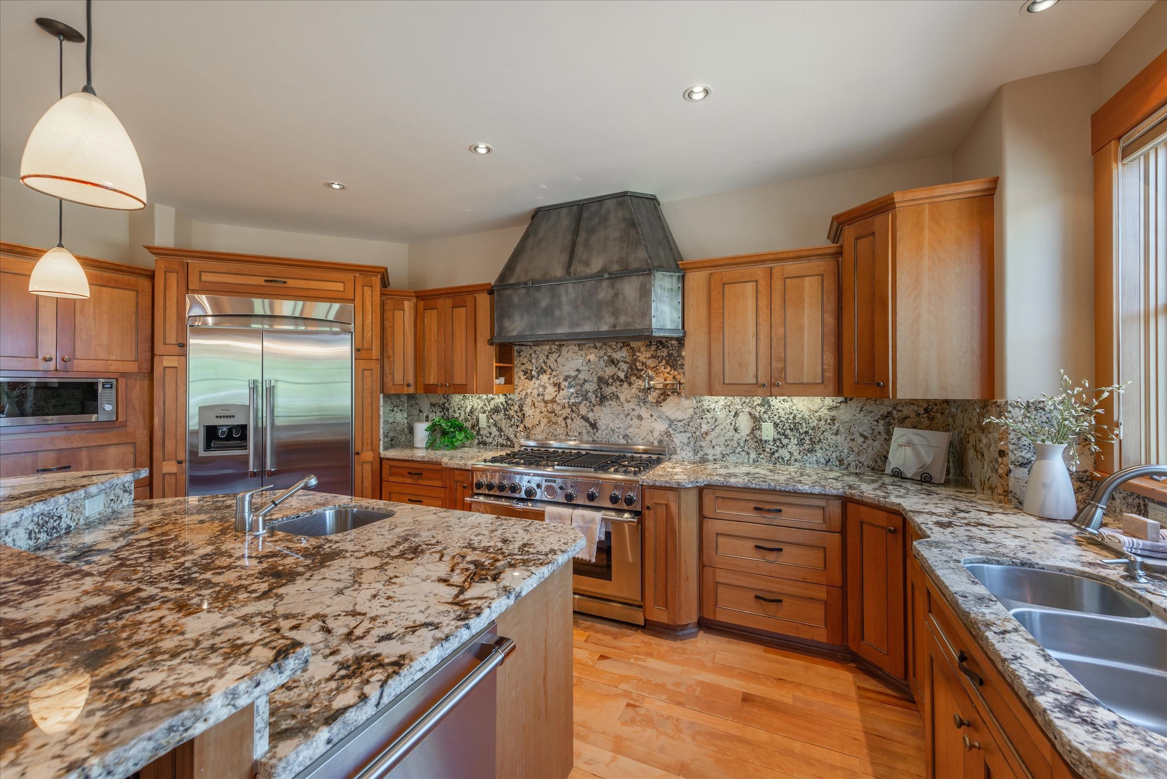 12416 Tom Dolley Truckee, CA 96161 - Photo 6 of 21 a kitchen with stainless steel appliances granite countertop a sink stove and cabinets