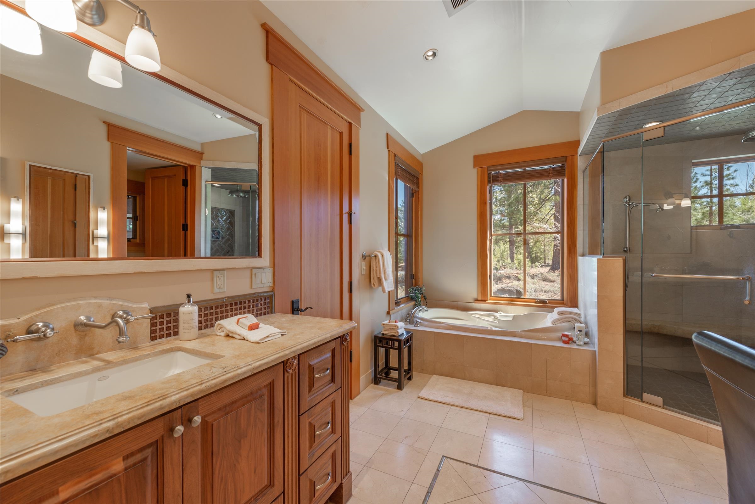 12416 Tom Dolley Truckee, CA 96161 - Photo 9 of 21 a spacious bathroom with a tub sink and mirror