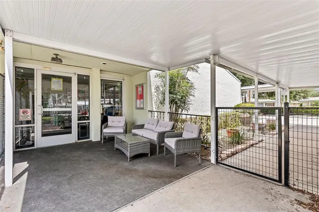 a view of a house with a yard porch and sitting area