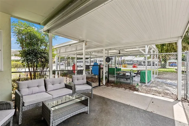 a view of a backyard with sitting area