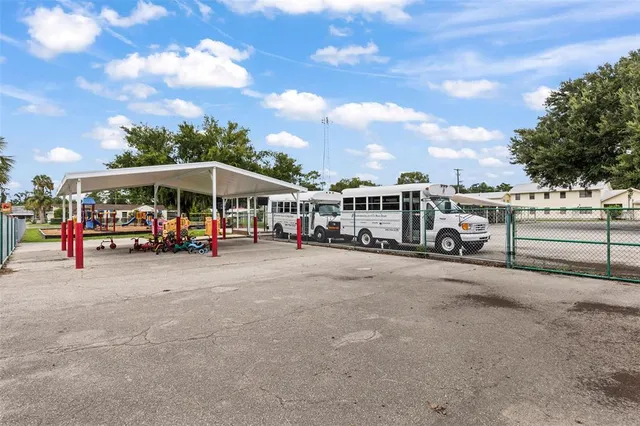 a view of a park with swings and slides