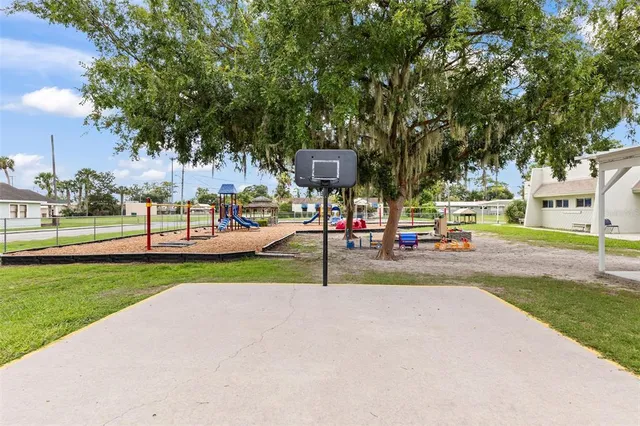 a dining area with stainless steel appliances kitchen island a table and chairs
