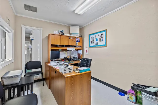 a dining room with a table and chairs